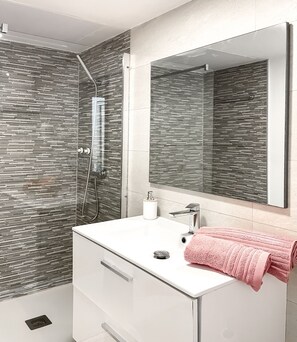 Shower, hair dryer, towels, soap