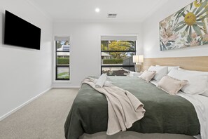 Master Bedroom 1 of Villa 52 showing king split apart bed and TV