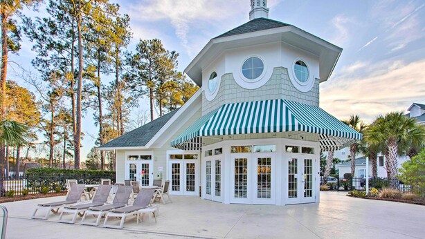 A building with a unique architectural design, featuring a rounded roof and circular windows.
