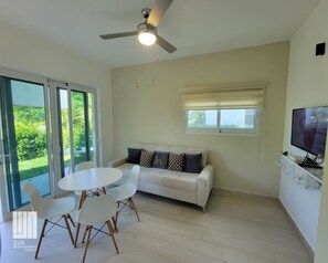 Business Apartment | Living area | Flat-screen TV - 2JA Management Group - White Hill Condos (Sosúa)