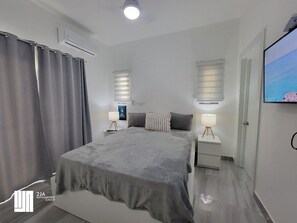 Condo Prestigio | Caja de seguridad en la habitación, cortinas blackout y wifi gratis