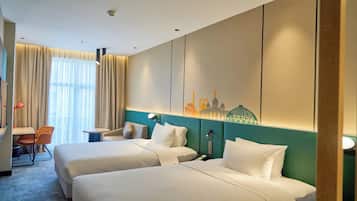 Literie hypoallergénique, coffres-forts dans les chambres, bureau