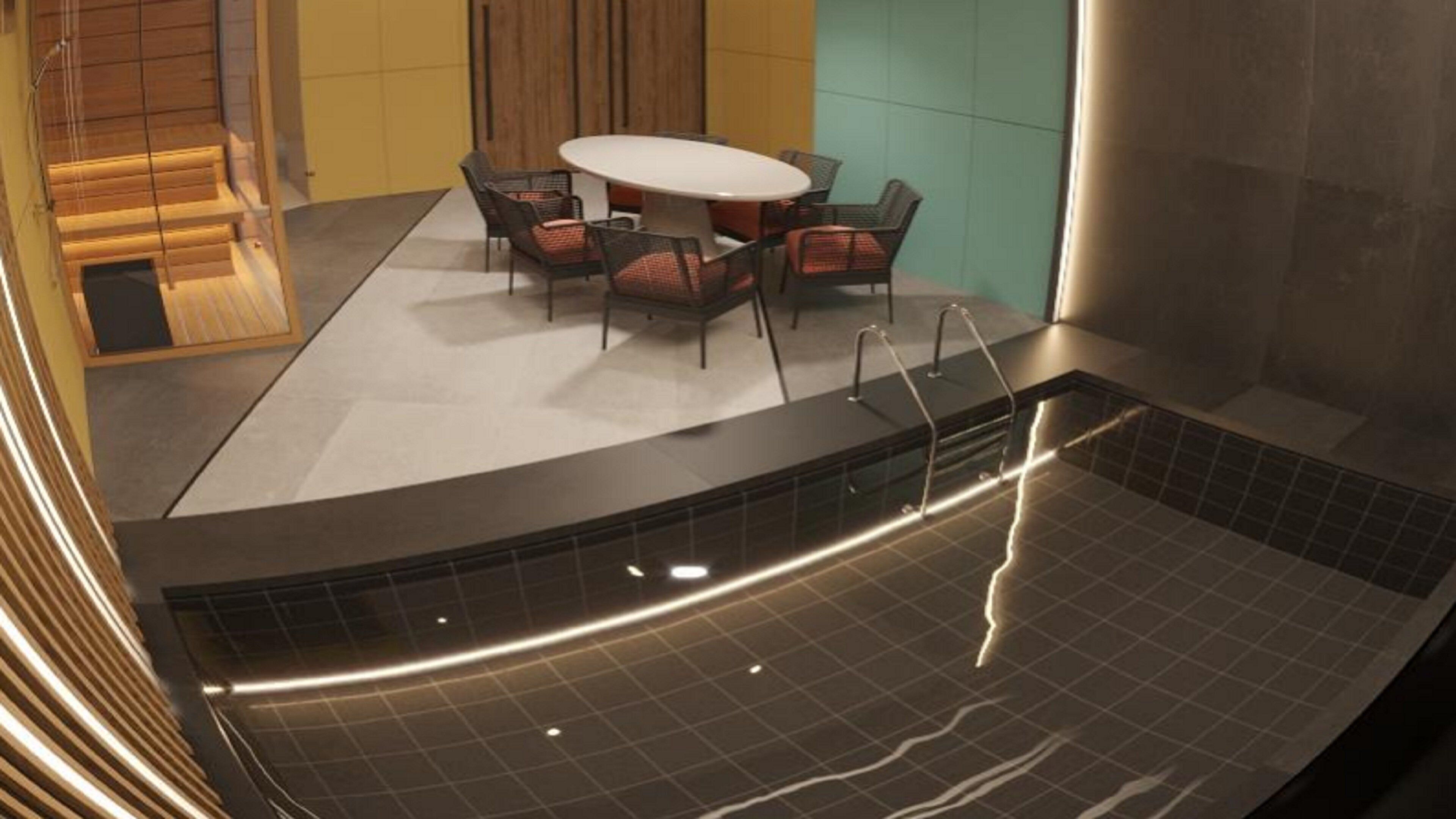 A modern indoor pool area with a seating area and a pool table.