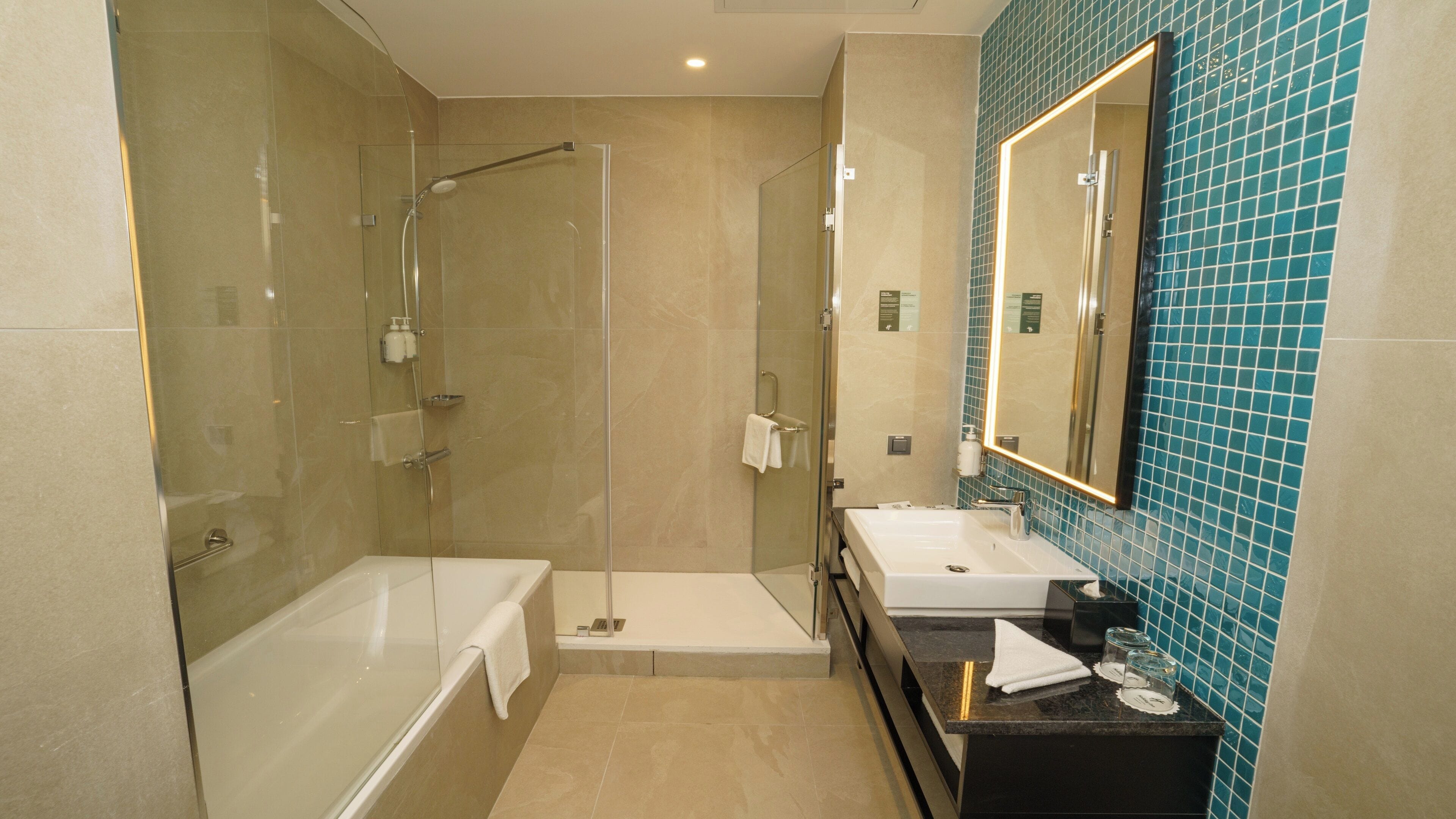 Suite, 1 Bedroom, City View | Bathroom | Hair dryer, slippers, towels