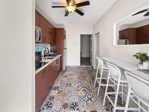 Fridge, microwave, stovetop, coffee/tea maker