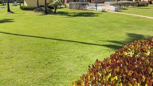 A resort with multiple buildings, a swimming pool, and well-maintained lawns. - Cozy Beach Front Apt @ Palmas del Mar w/ 2 Pools (Palmas del Mar)