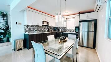 Fridge, microwave, stovetop, coffee/tea maker