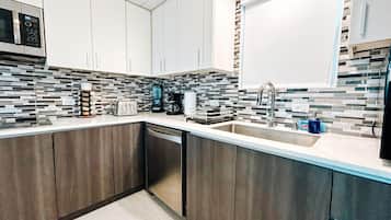 Fridge, microwave, stovetop, coffee/tea maker