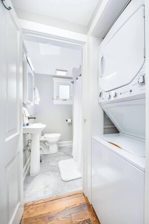 Shower, hair dryer, towels, shampoo