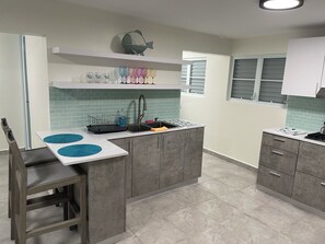 Fridge, microwave, stovetop, coffee/tea maker