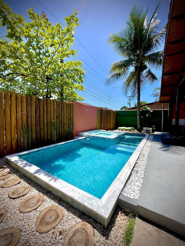 Outdoor pool, open 10:00 AM to 9:30 PM, pool loungers