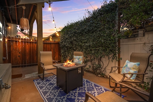 Cozy Patio with Fire Pit and String Lights