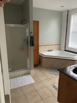 Jetted tub, hair dryer, towels, soap