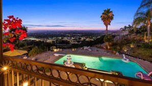 A pool with a view of a cityscape at dusk. - Central Location, Spectacular Views, Pool, Hottub (Escondido)