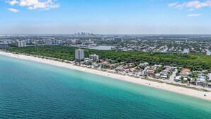 An aerial view of a coastal city with a beachfront, dense urban area, and a large body of water. - Steps from the Beach / Heated Pool / Seaside Key (Fort Lauderdale)