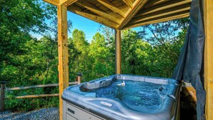 A hot tub in a wooden gazebo surrounded by trees. - Lones Branch Lodge - Stunning new build! (Sevierville)
