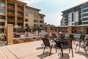Fire pit next to the outdoor heated pool and hot tub - Sundial C407-A | Ski-in/Ski-out | Village Views | Pools & Hot Tubs | Fitness Room (Park City)