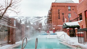 A pool area with a sign reading "Shadow Ridge." - Shadow Ridge 201-1 | Short Walk to Skiing | Mountain & Ski Views | Food Galley | Pool & Hot Tub (Park City)