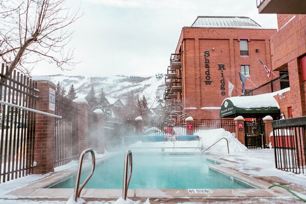 A pool area with a sign reading "Shadow Ridge." - Shadow Ridge 408-1 | 150 Yards to Slopes | Mtn Views | Top Floor | Food Galley | Pool & Hot Tub (Park City)