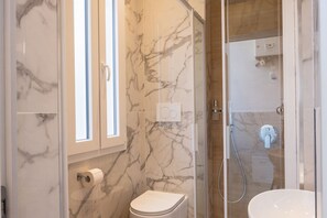 Shower, eco-friendly toiletries, hair dryer, bidet