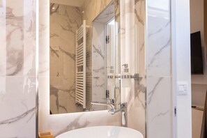 Shower, eco-friendly toiletries, hair dryer, bidet