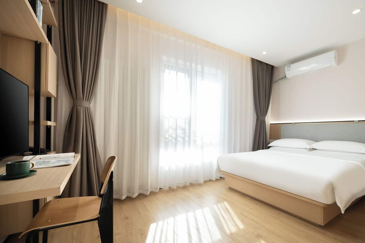 Economy Room | Free minibar, desk, blackout drapes, iron/ironing board