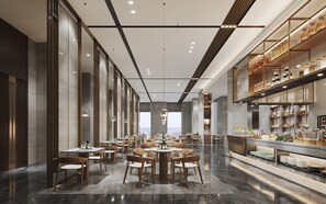 Un moderno comedor con varias mesas y sillas, una barra de buffet con mostradores de comida y ventanas amplias con vista a la ciudad.