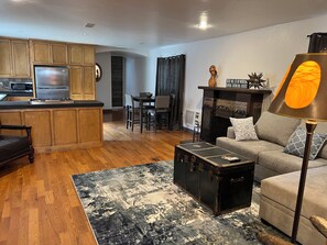 Relax in this inviting living space with a kitchen, dining area, and cozy seating area.