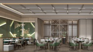 A modern dining area with round tables and green chairs, featuring a geometric wall design and recessed lighting. - Holiday Inn Xian East (Xi'an)