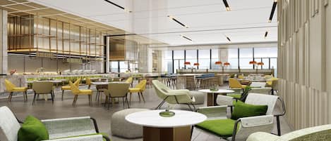 A spacious indoor area with multiple seating arrangements, including chairs and tables, and a large window providing a view of the cityscape.