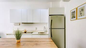 Fridge, microwave, stovetop, coffee/tea maker