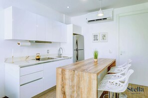 Fridge, microwave, stovetop, coffee/tea maker
