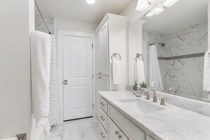 Combined shower/tub, jetted tub, hair dryer