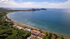 An aerial view of a coastal area with a beach, boats, and buildings. - Inviting Home with Colorful Decor and Private Backyard Oasis with a Swimming Pool & Shaded Terrace (Santa Cruz)