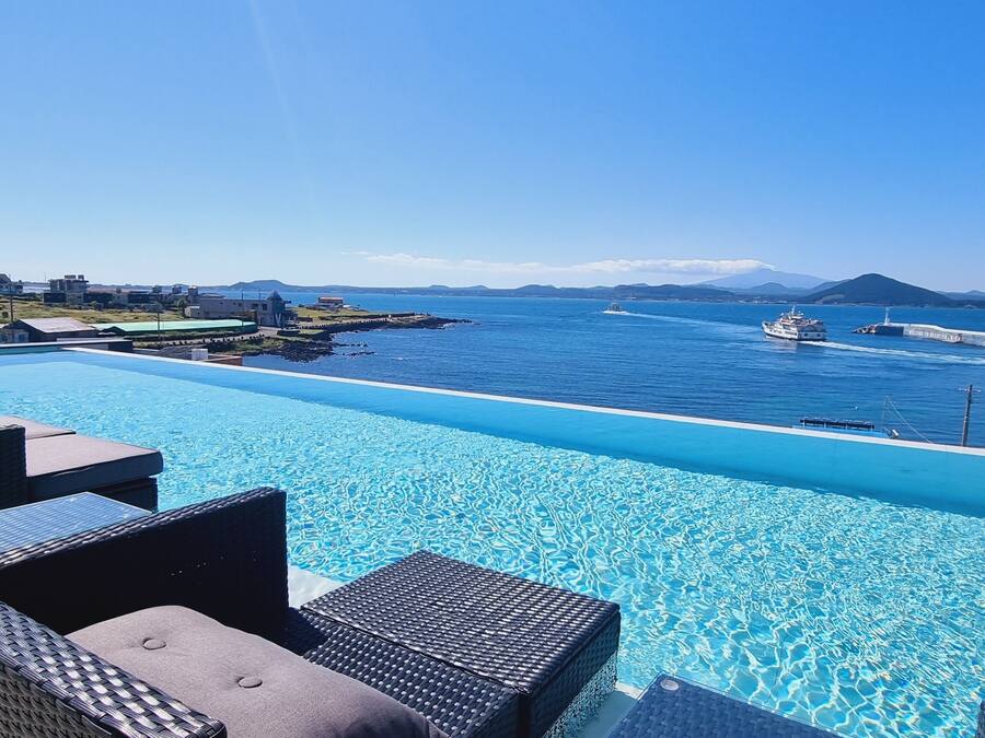 Seasonal outdoor pool, open noon to 10:00 PM, sun loungers