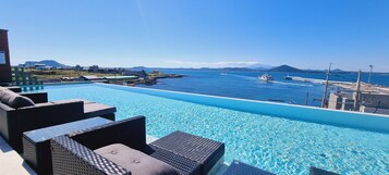 Seasonal outdoor pool, open noon to 10:00 PM, sun loungers