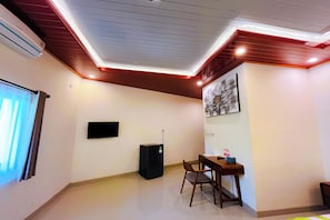 Deluxe Room, Pool View | Individually decorated, individually furnished, desk, iron/ironing board