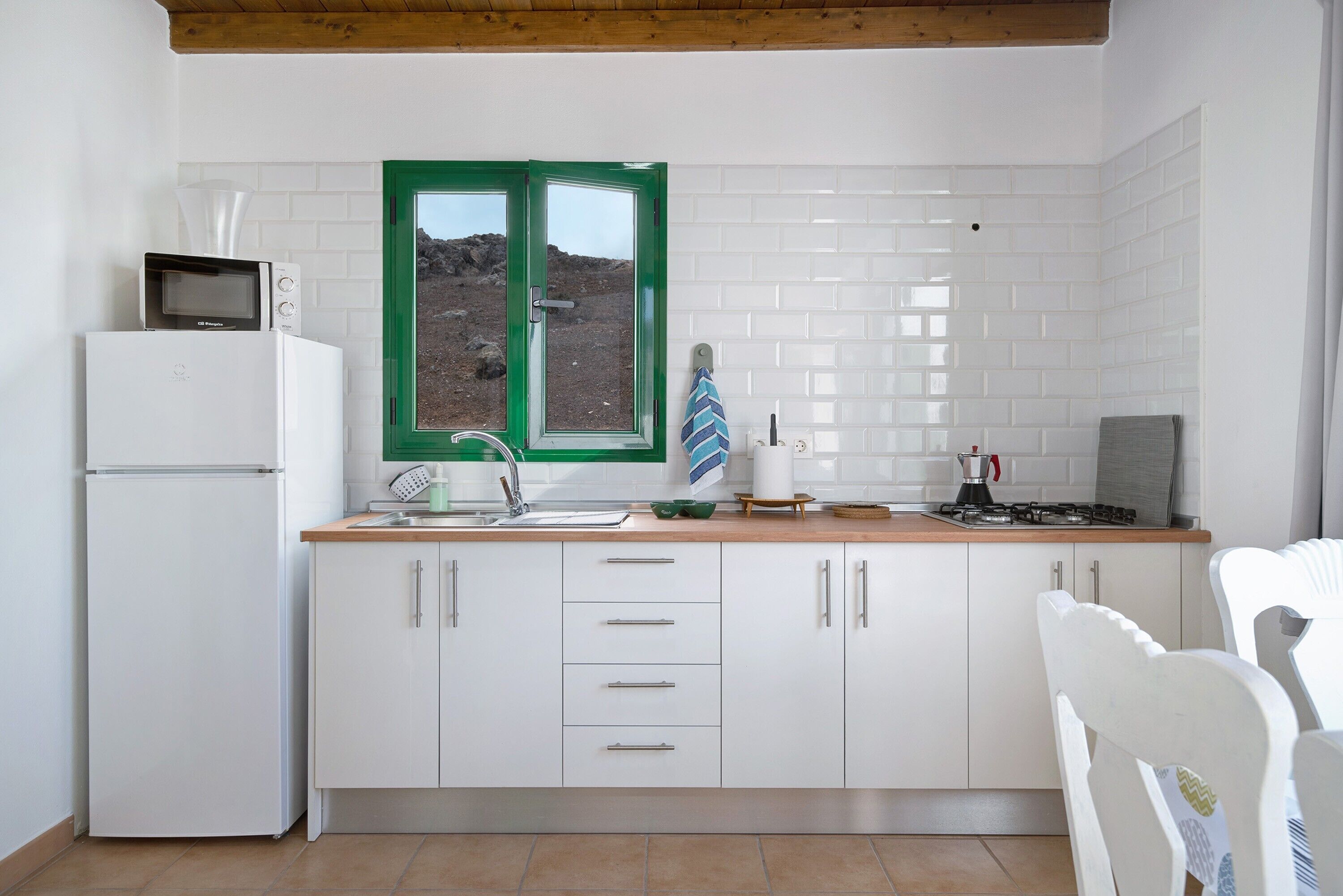 Fridge, microwave, stovetop, coffee/tea maker