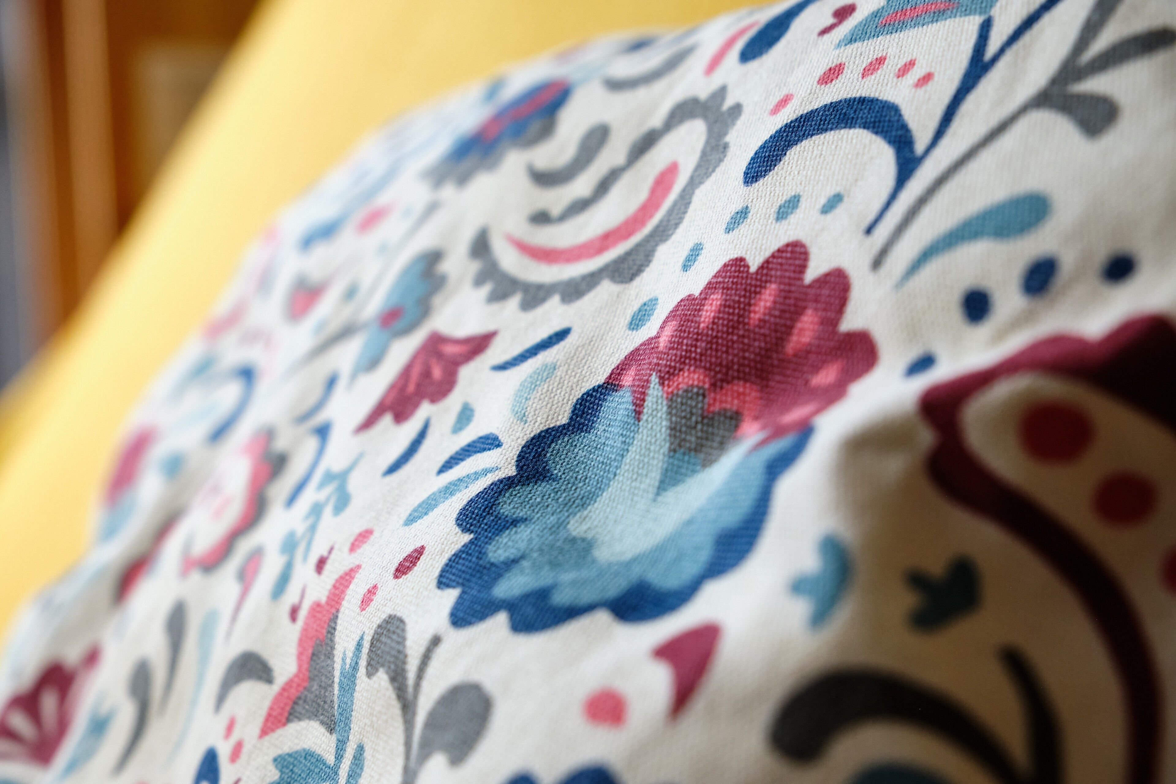 A close-up of a fabric with a floral pattern.