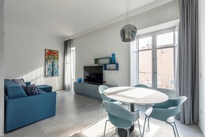 City Apartment | Living area | 32-inch TV with digital channels