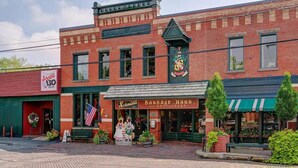 A historic building with a sign for 'Schmidt's Sausage Haus and Restaurant' and a '130 Years' celebration banner. - Enjoy your stay in this cozy, newly renovated condo in the heart of German Village (Columbus)