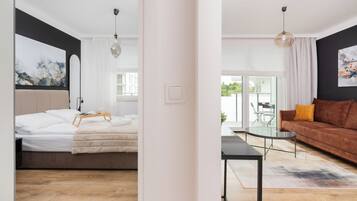 Apartment, 1 Bedroom, Balcony | Living area | 25-inch flat-screen TV with cable channels