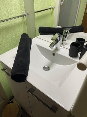 Hair dryer, towels, soap, toilet paper