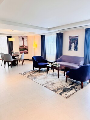 Junior Suite, 1 King Bed | Living area | 43-inch flat-screen TV with digital channels, TV