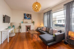 Basic Apartment, 2 Queen Beds | Living area | TV