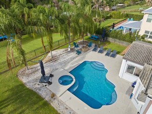Outdoor pool, a heated pool - Ocean access with boat dock 4 bedroom 3 bathroom beautiful Pool home with Spa.  (Port St. Lucie)