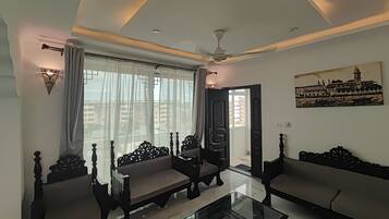 Standard Apartment, 3 Bedrooms, City View, Annex Building | Living area | 55-inch TV with digital channels