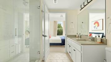 Shower, hair dryer, towels, shampoo