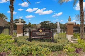 A sign for Swann Pond at Hyde Park Village, indicating its location at 179 Swann Avenue, City of Toronto Parks and Recreation.
