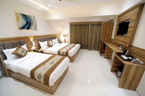 Quarto triplo executivo | Roupas de cama premium